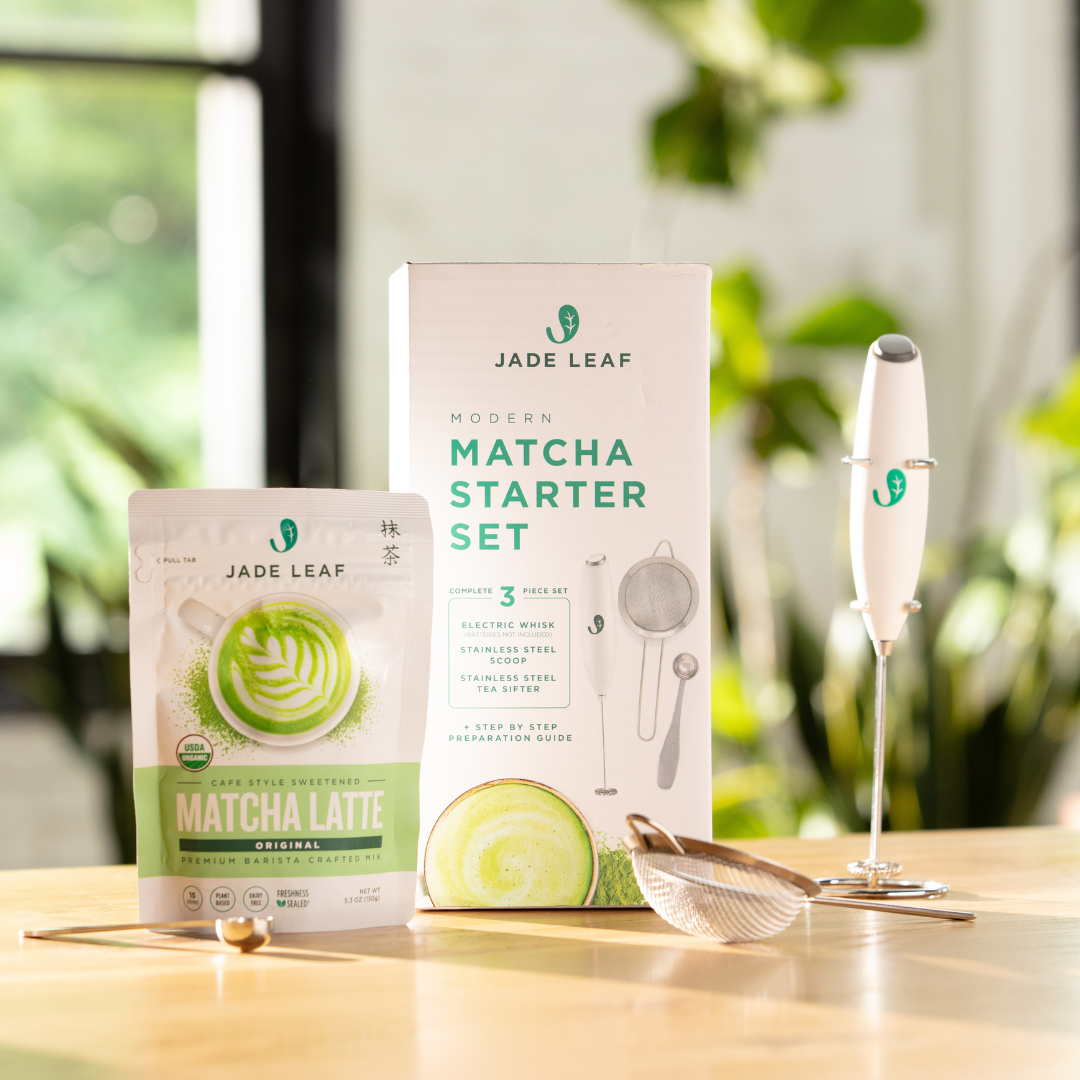 Cafe Style Matcha Latte Mix starter bundle with organic matcha pouch, electric whisk, steel sifter, scoop, and recipe handbook