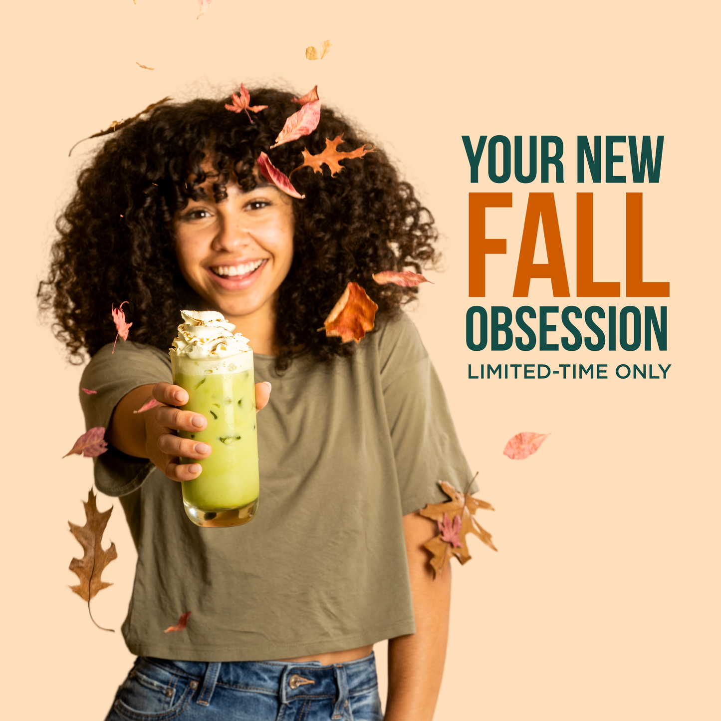 Cup of Pumpkin Spice Matcha Latte Mix with autumn decor, showing creamy latte topped with spices